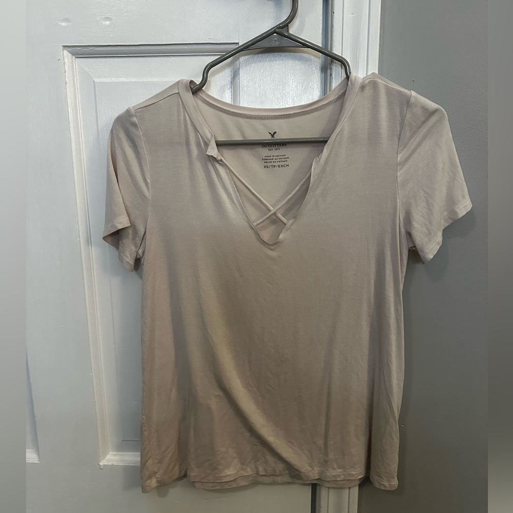 Light Pink American Eagle Soft Tee with cross front In size XS
